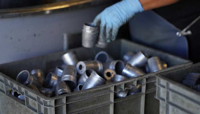 Metal housings for light fixtures during the manufacturing process