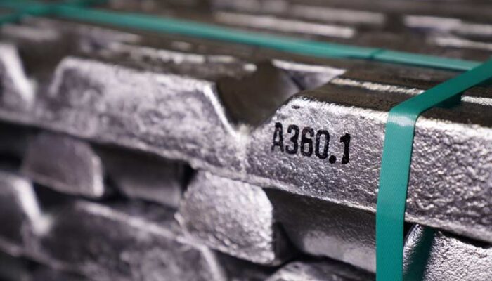 A close-up shot of metal used in the manufacturing process of lighting fixtures