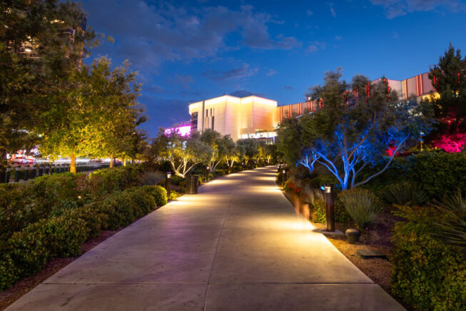 Illuminated landscaping outside of Resorts World Las Vegas