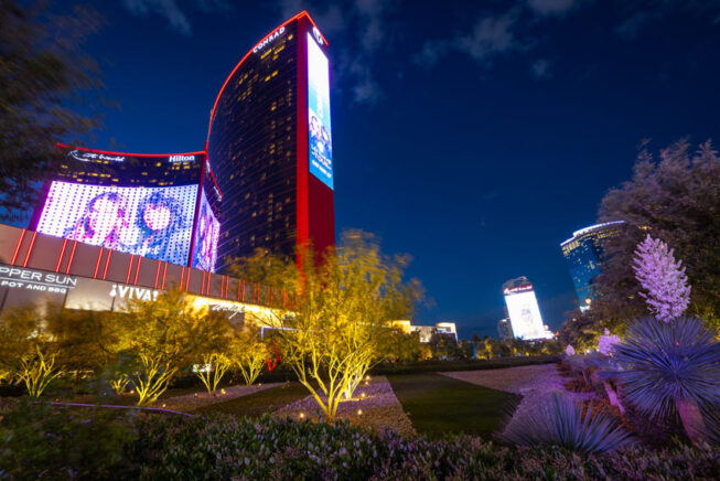 Illuminated landscaping outside of Resorts World Las Vegas